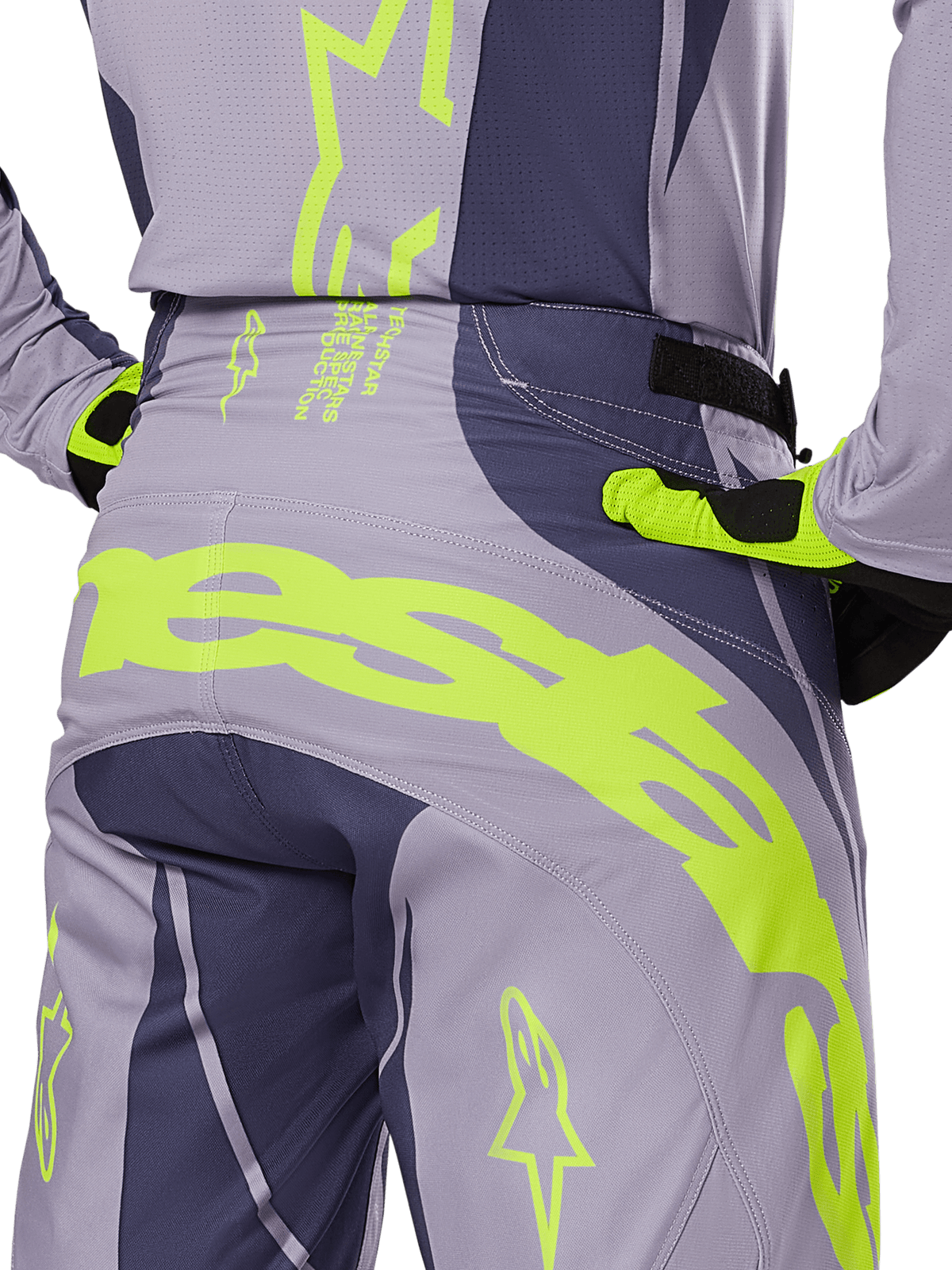 Alpinestars 2025 Techstar Dreem Pants, Motocross Pants, Gray and Dark Gray with fluorescent yellow accents, rear view showing bold Alpinestars branding across the yoke, worn with matching jersey and gloves, designed for off-road racing.