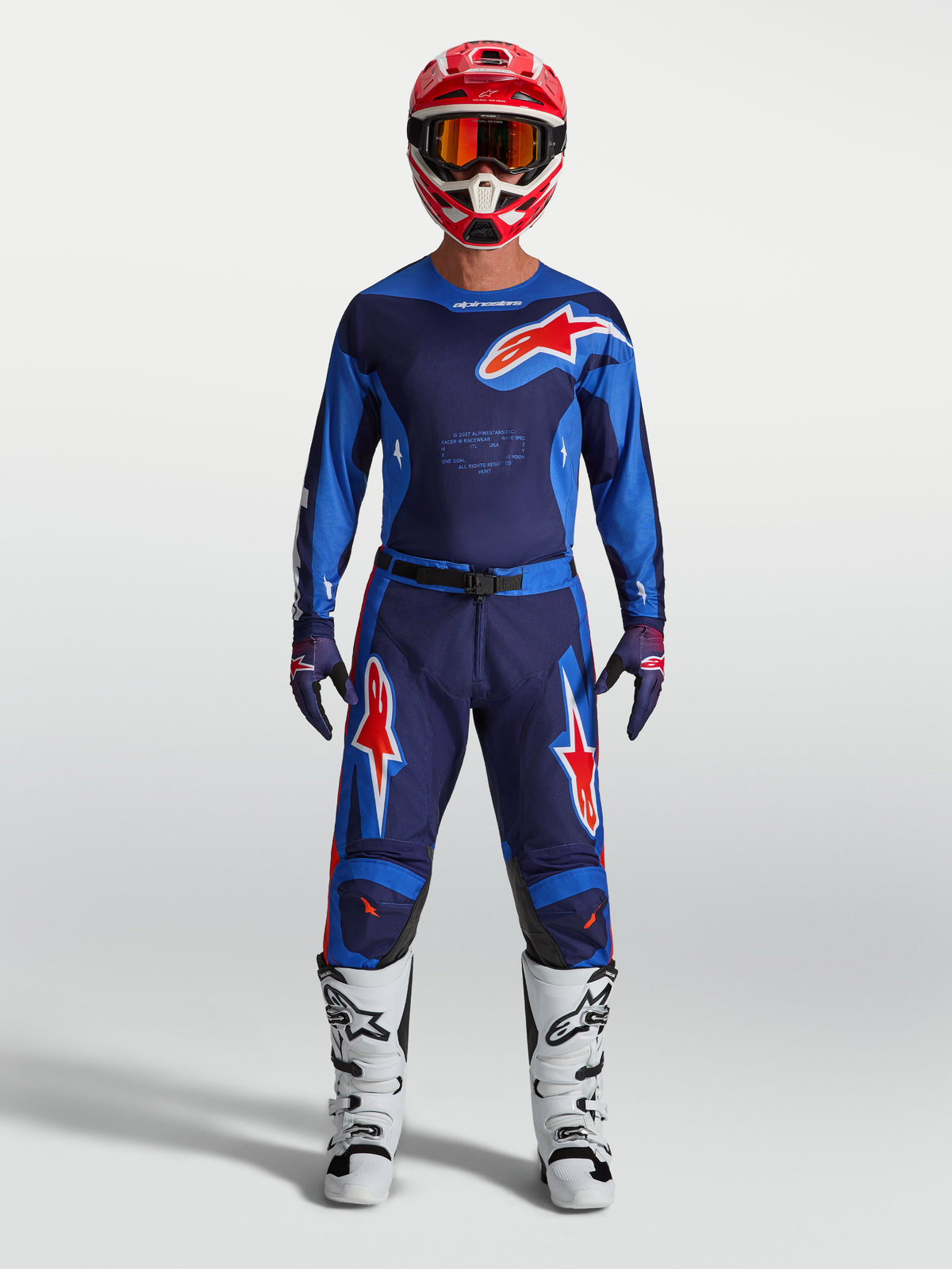 Alpinestars Racer Hunt, calças de motocross para homem, azuis e vermelhas, modelo com equipamento completo, construção durável e design ergonómico para pilotagem off-road.