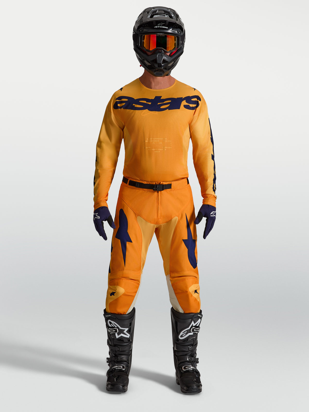 Alpinestars Racer Amber gear set e calças 2027, kit de corrida de motocross laranja e azul com camisola e botas.