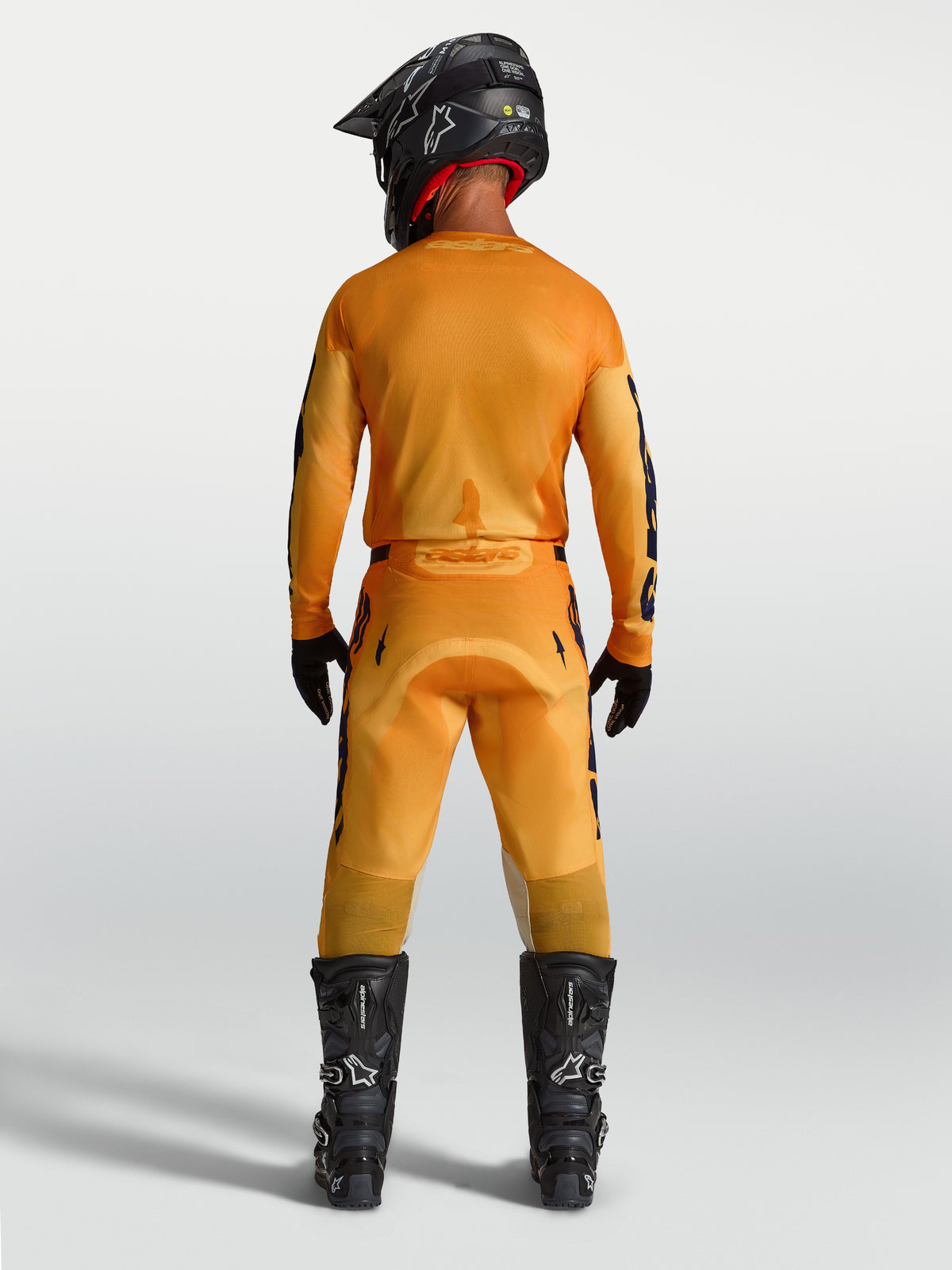 Alpinestars Racer Amber, calças de motocross para homem, laranja e azul escuro, vista traseira, construção resistente em polifibra