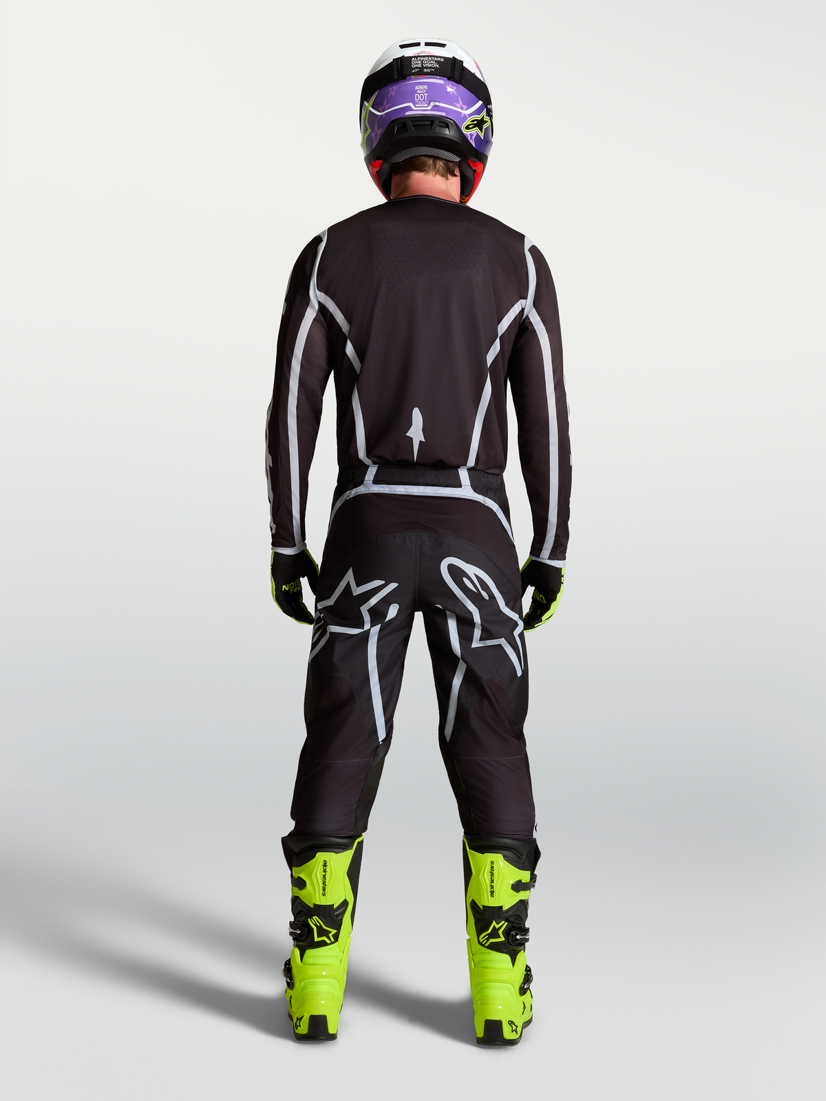 Alpinestars Calças Fluid Apex V2, calças de motocross para homem, pretas e prateadas, vista traseira com ajuste desportivo.