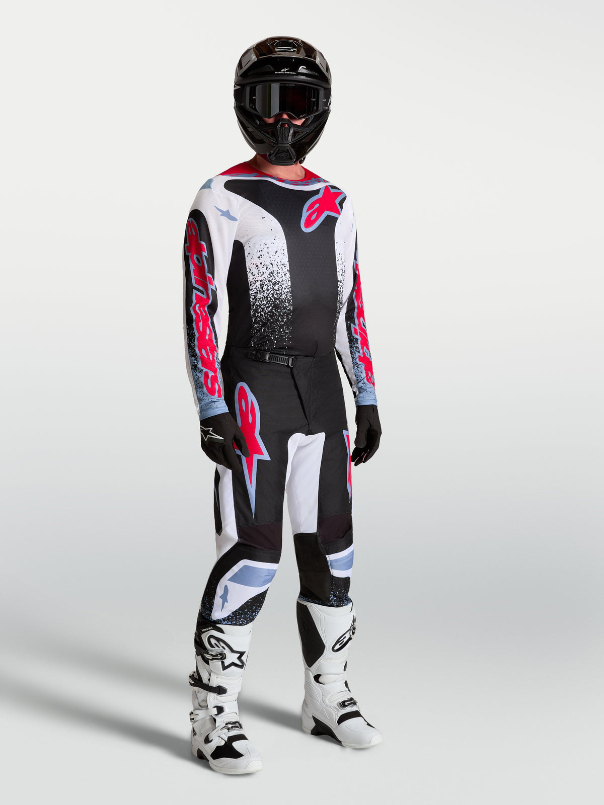 Alpinestars Calças Fluid Drag, calças de motocross pretas e brancas com detalhes em vermelho flúor, para homem.