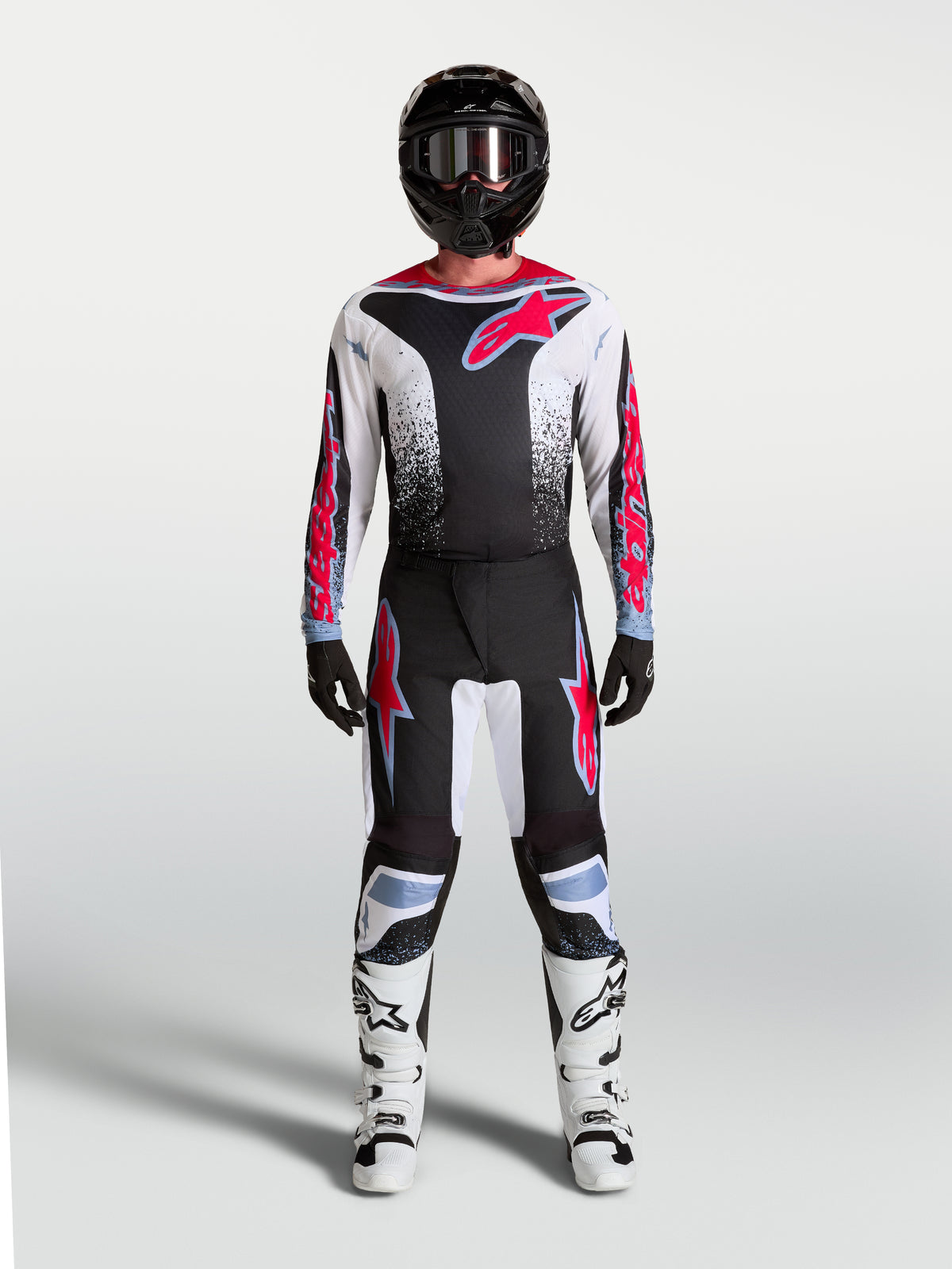 Alpinestars calças Fluid Drag para homem, pretas e brancas com detalhes vermelho fluo, ajuste ergonómico de motocross