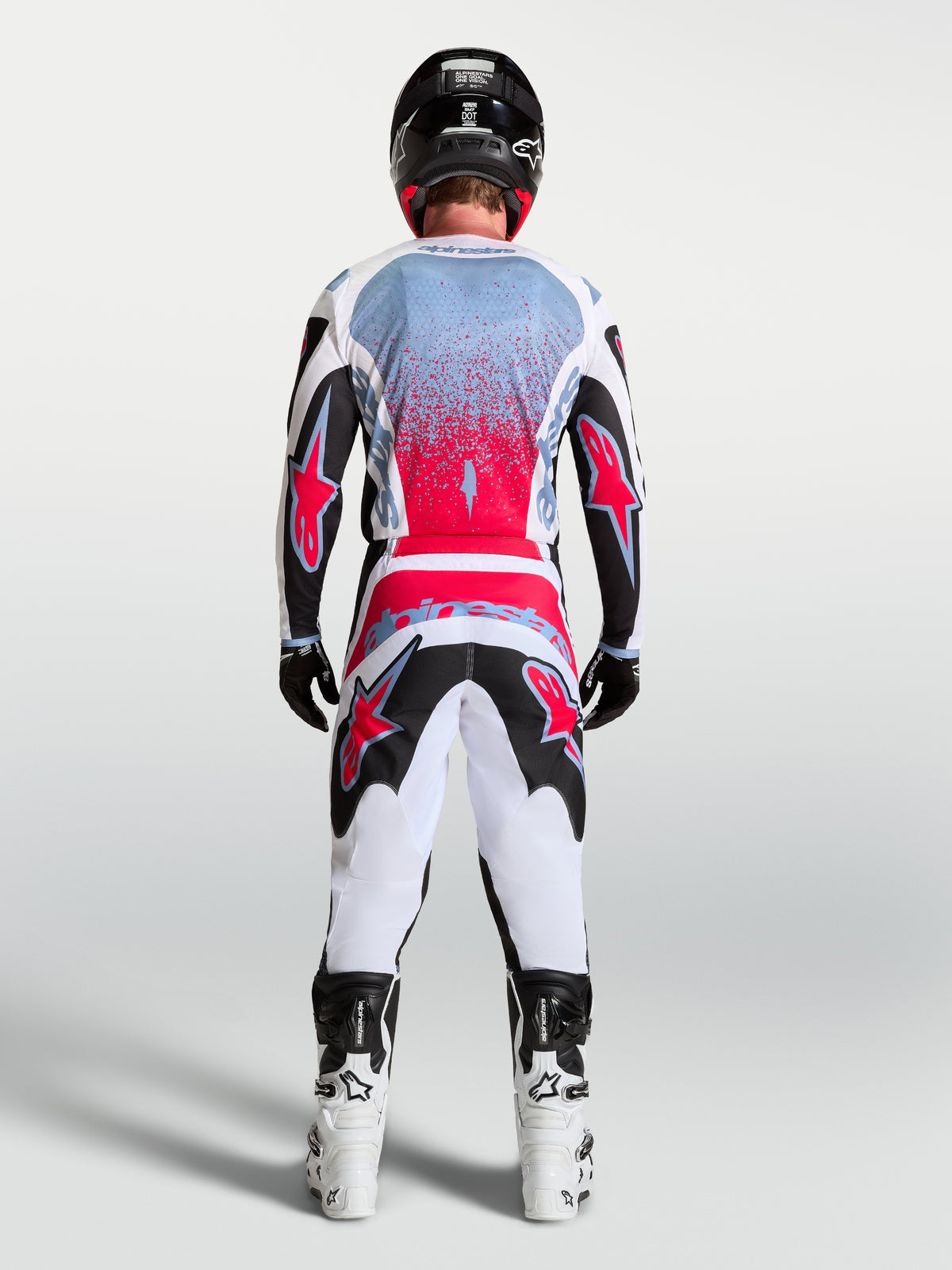 Alpinestars calças Fluid Drag, calças de motocross para homem, pretas, brancas e vermelho fluo, vista traseira, construção 3D.