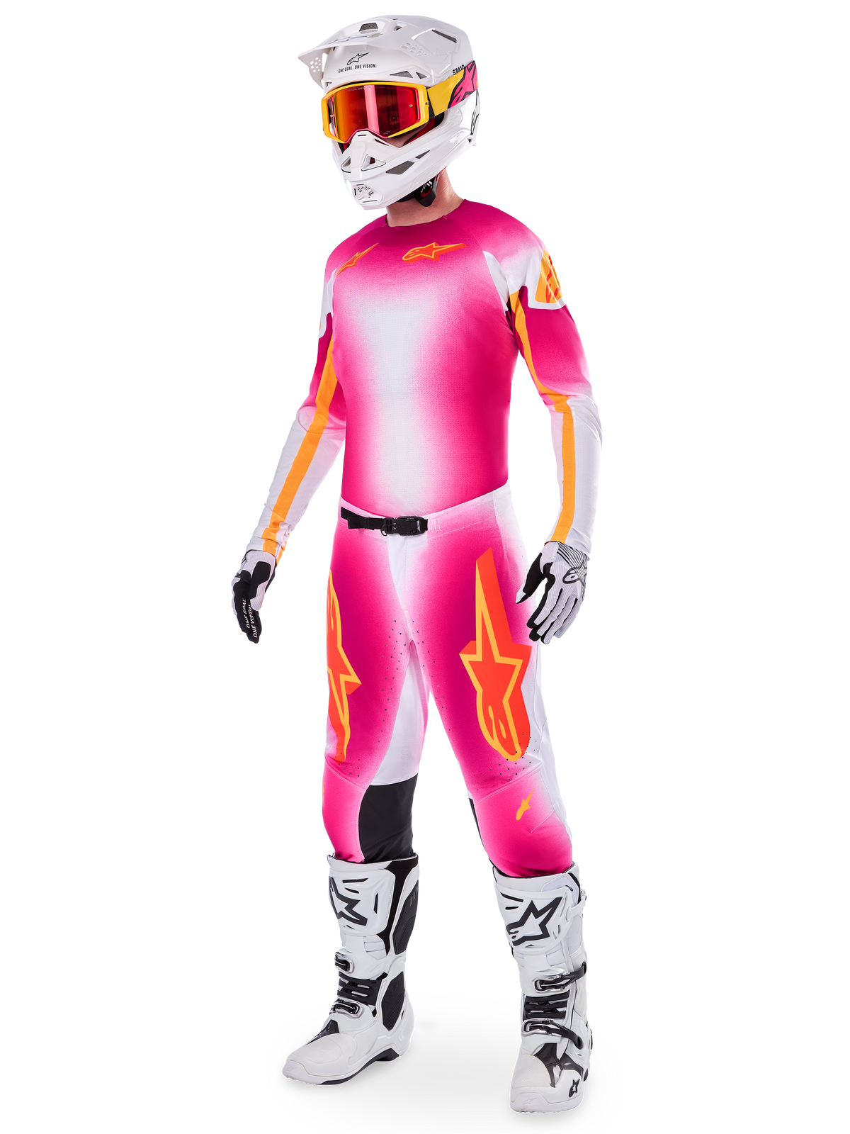 Piloto de motocross a usar o conjunto Alpinestars Supertech AFD MIG Edição Limitada, camisola e calças com degradê em rosa fluo, branco e laranja, capacete branco com óculos laranja, botas brancas e pretas, equipamento profissional de motocross