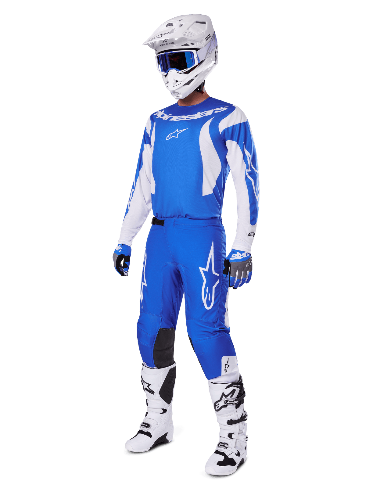 Motocross rider wearing the complete 2025 Fluid Haul Gear Set, Blue and White jersey and pants with Alpinestars branding, white helmet with blue goggles, white boots, and blue gloves, coordinated racing outfit for off-road motocross.