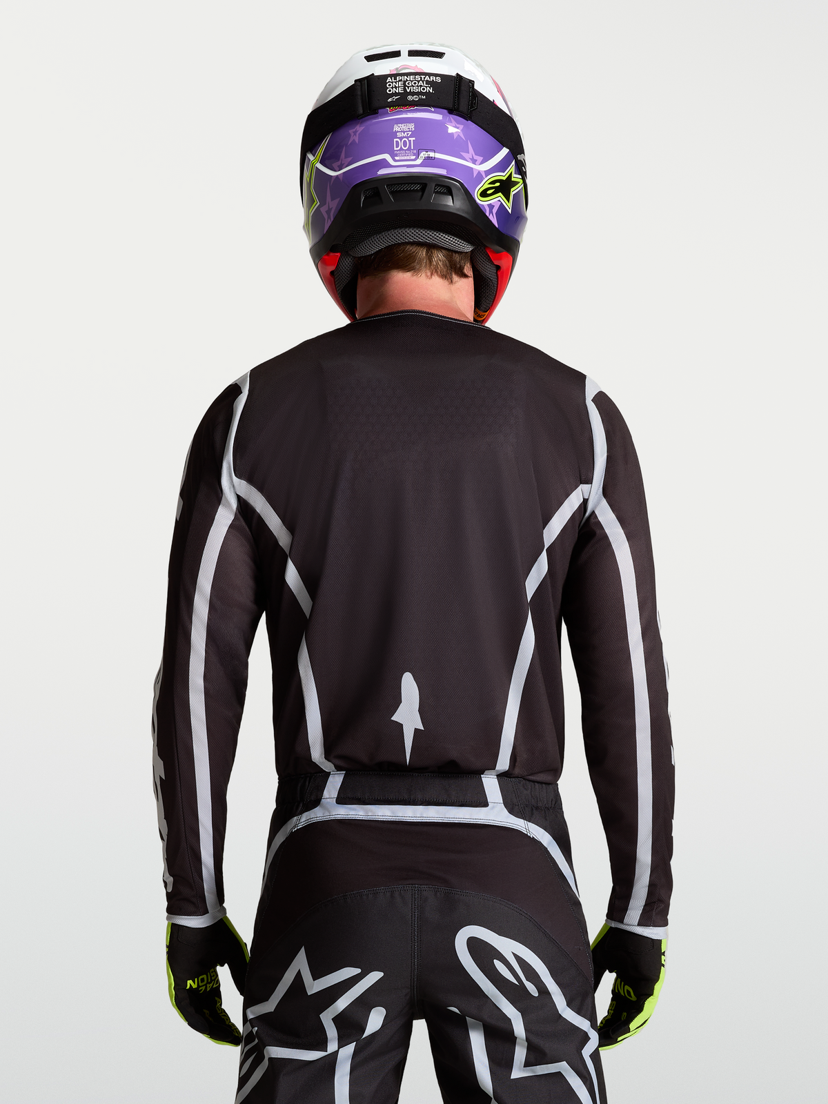 Alpinestars Fluid Apex V2 Jersey, Men's Motocross Jersey, Black and Silver, rear view on-model with ergonomic athletic fit.