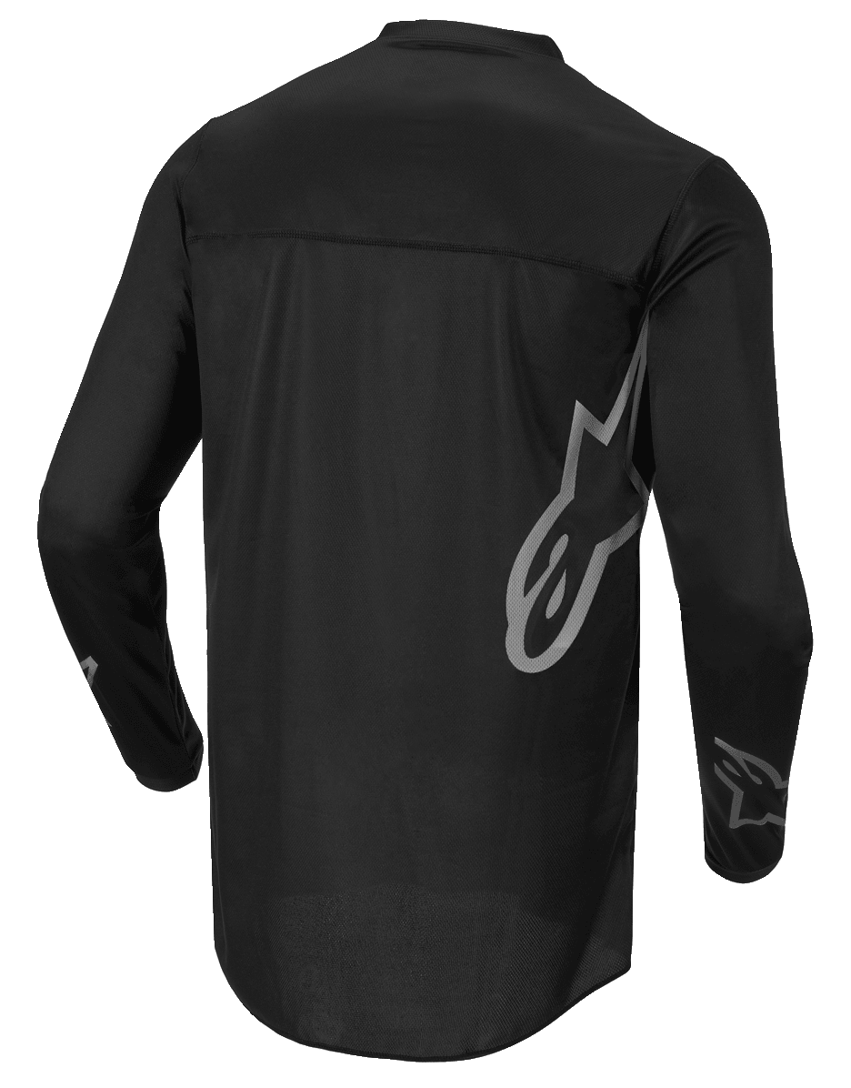 Alpinestars Fluid Graphite Jersey, camisola de motocross, preto e cinzento escuro, vista traseira, com grande logótipo Alpinestars cinzento na lateral e gráficos nas mangas, tecido leve com absorção de humidade para corridas todo-o-terreno