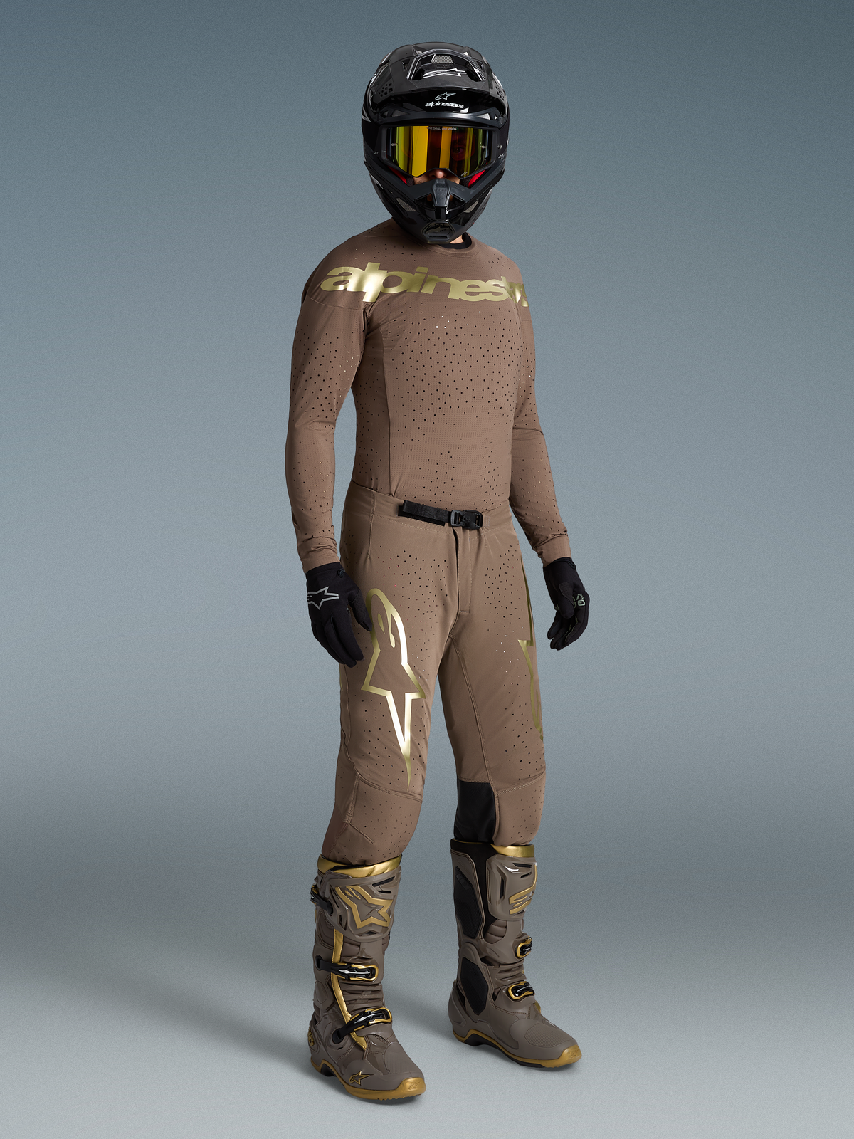 Camisola Supertech Air Gold Edição Limitada da Alpinestars, de motocross, castanha e dourada com ventilação a laser.
