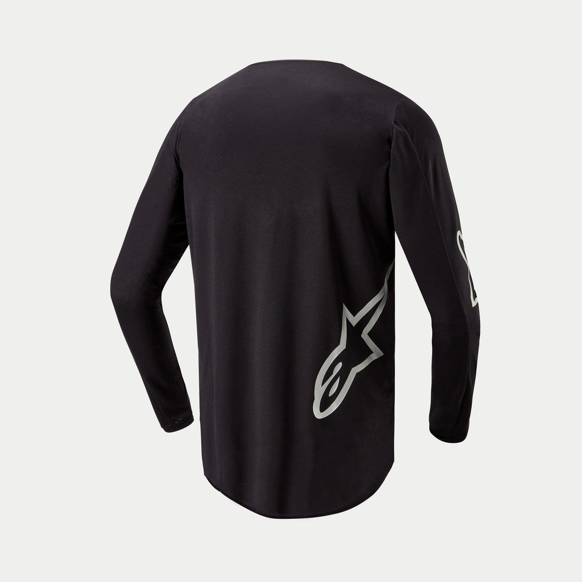 Alpinestars 2024 Fluid Graphite Jersey, camisola de motocross, preta e prateada, vista traseira com logótipo de estrela prateada na lateral inferior, design de manga comprida com parte traseira prolongada para cobertura em condução todo-o-terreno.