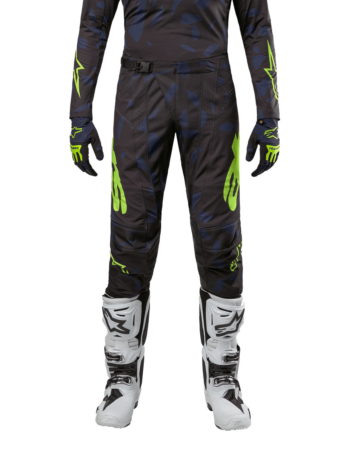 Calças Alpinestars 2024 Techstar Rantera, calças de motocross, em preto, azul-marinho e amarelo fluorescente, usadas com camisola de manga comprida a condizer, luvas e botas de motocross brancas, com detalhes em amarelo néon e padrão escuro abstrato.