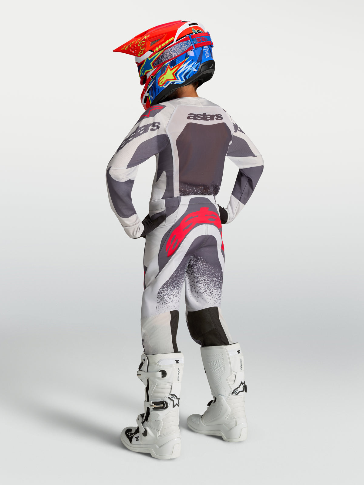 Alpinestars Supertech Swan, conjunto de motocross para juventude, cinzento e branco com detalhes vermelhos, ajuste de corrida
