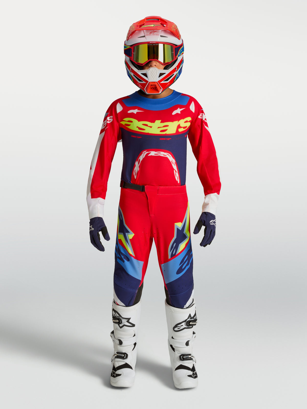 Alpinestars conjunto Supertech Dyna jovem, equipamento de motocross vermelho e azul-marinho para jovens pilotos.