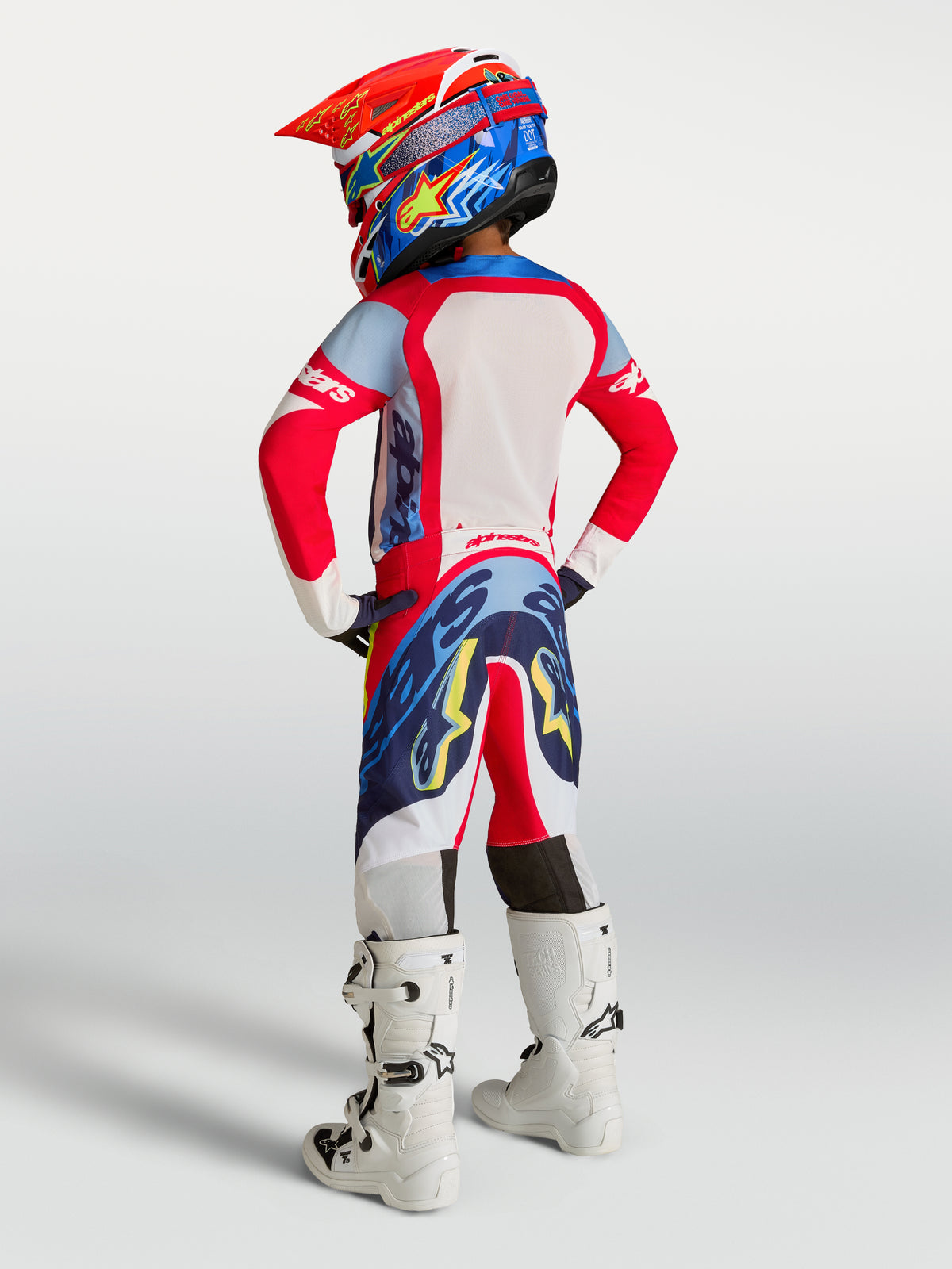 Alpinestars Juventude Supertech Dyna Gear Set, conjunto de motocross vermelho e azul, ajuste de corrida, vista traseira