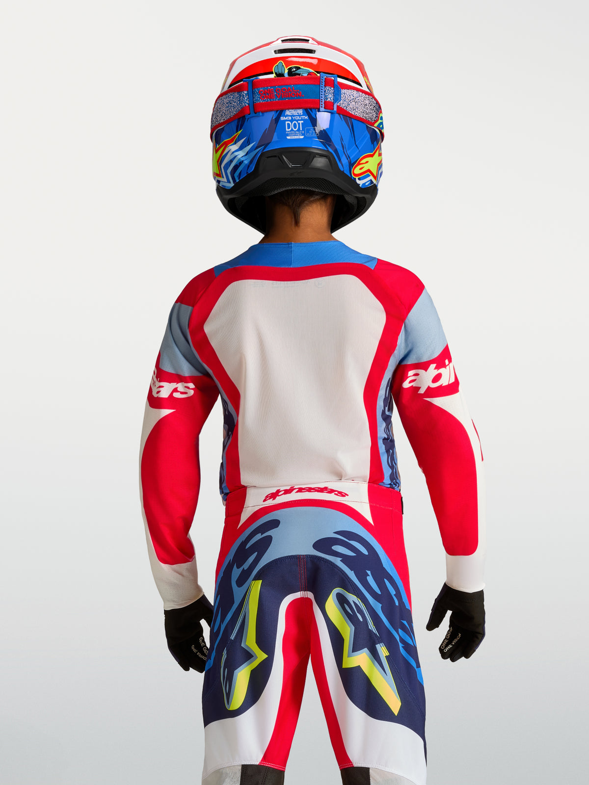 Alpinestars Supertech Dyna Jovem 2027, camisola de motocross vermelha e azul-marinho, vista traseira, malha elástica leve.
