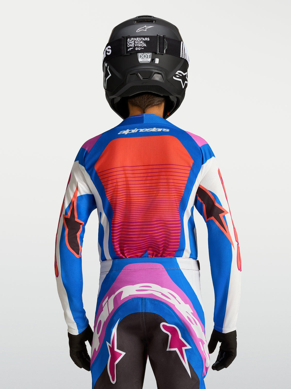 Alpinestars Supertech Maven Jovem, camisola de motocross azul e coral, vista traseira com painéis em malha respiráveis.