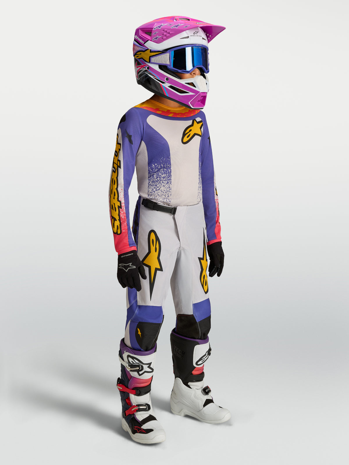 Alpinestars Juventude Fluid Drag Gear Set, conjunto de motocross para jovens, azul e branco com detalhes rosa e dourados.