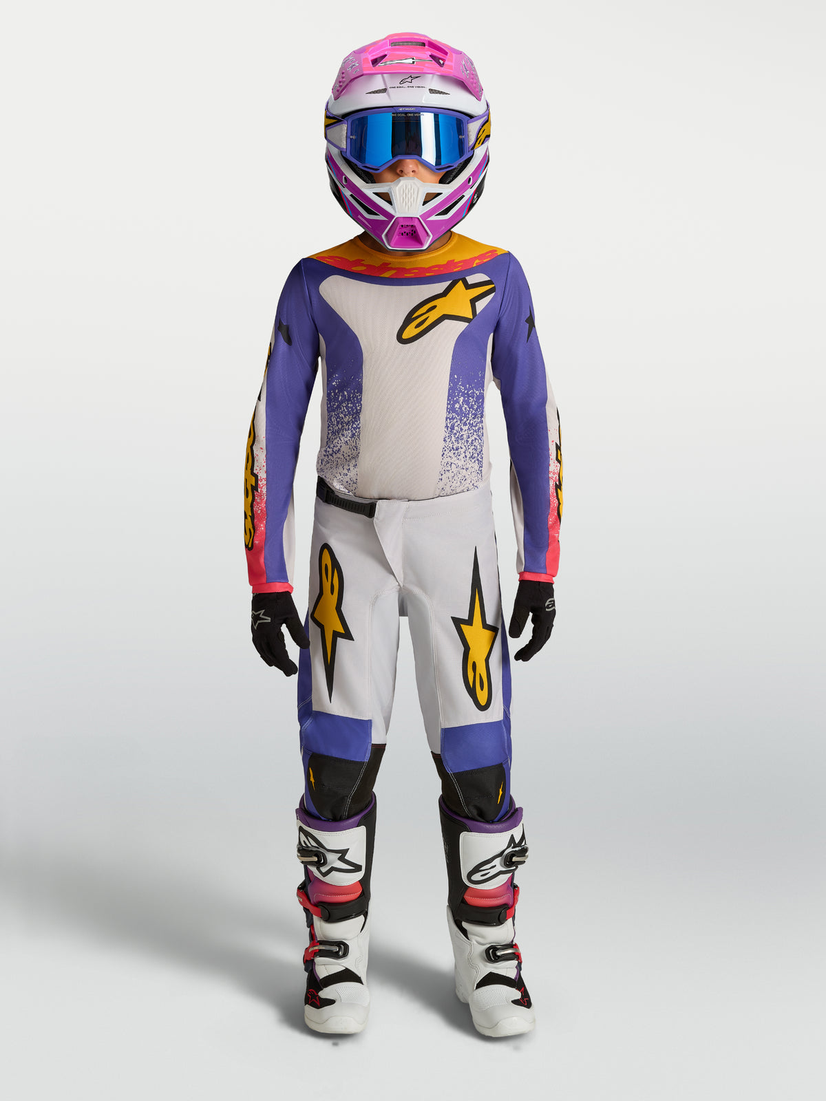Alpinestars camisola e gear set Fluid Drag juventude 2027, conjunto de motocross para jovens em lilás e branco com pormenores dourados, ajuste ergonómico off-road.