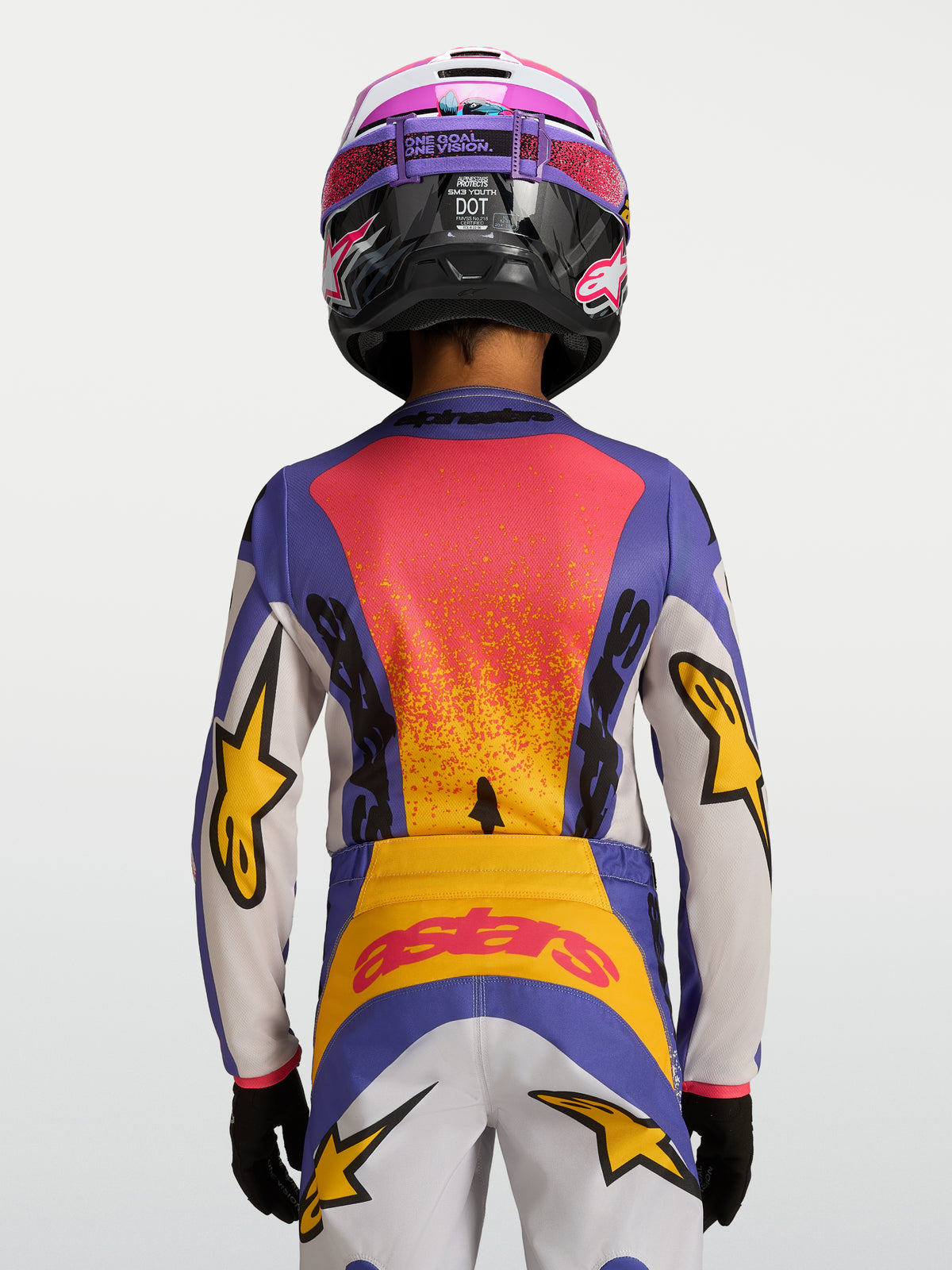 Alpinestars Camisola Fluid Drag Juventude 2027, camisola de motocross azul e amarela, vista traseira, gráficos de corrida.