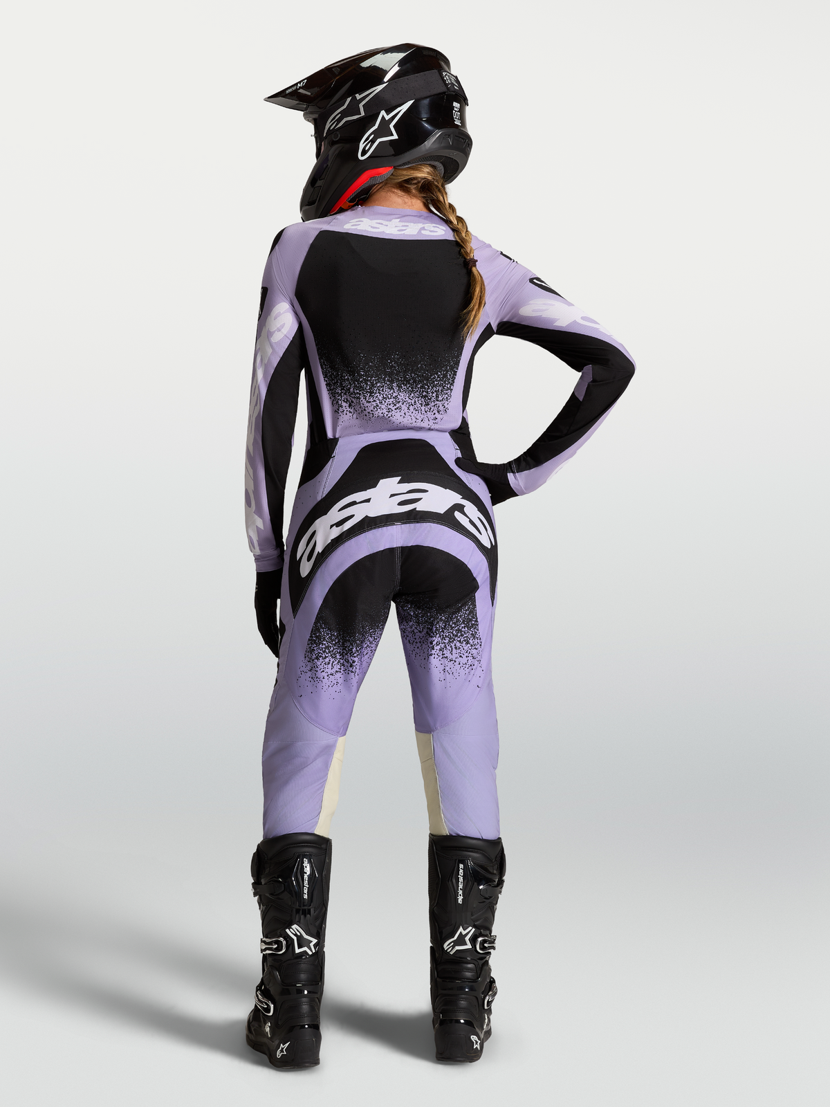 Alpinestars Stella Techstar Swan, calças de motocross para mulher, roxas e pretas, ajuste ergonómico para corrida, vista traseira.