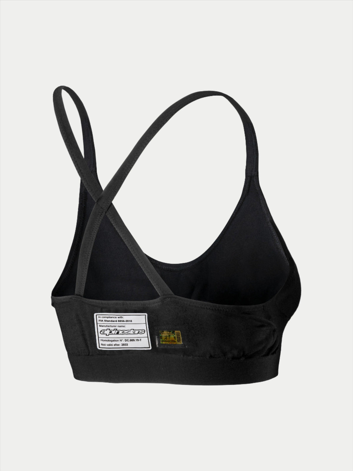 Alpinestars Stella TECH ZX Bra, sutiã de base para automobilismo, preto, vista traseira com etiqueta de certificação FIA 8856-2018, alças finas cruzadas, material leve resistente às chamas para proteção em desportos motorizados.