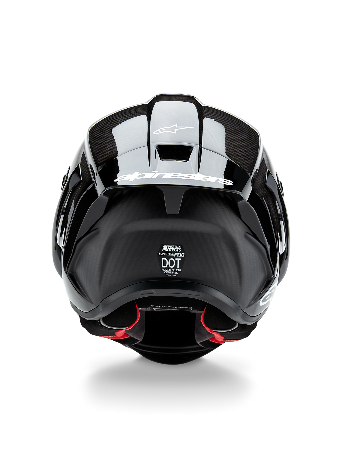 Alpinestars Supertech R10 Solid Helmet, Motorcycle Helmet, Black Carbon Matte and Glossy, rear view featuring carbon fiber texture, aerodynamic spoiler with white Alpinestars logo, DOT and ECE safety certification labels, and red interior padding