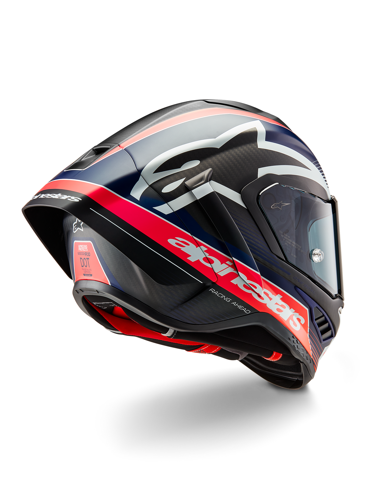 Capacete Alpinestars Supertech R10 Team, capacete profissional de corrida para motociclismo, carbono preto com detalhes em vermelho fluorescente e azul mate, vista traseira aerodinâmica com spoiler integrado, branding Alpinestars em destaque e textura de fibra de carbono visível.