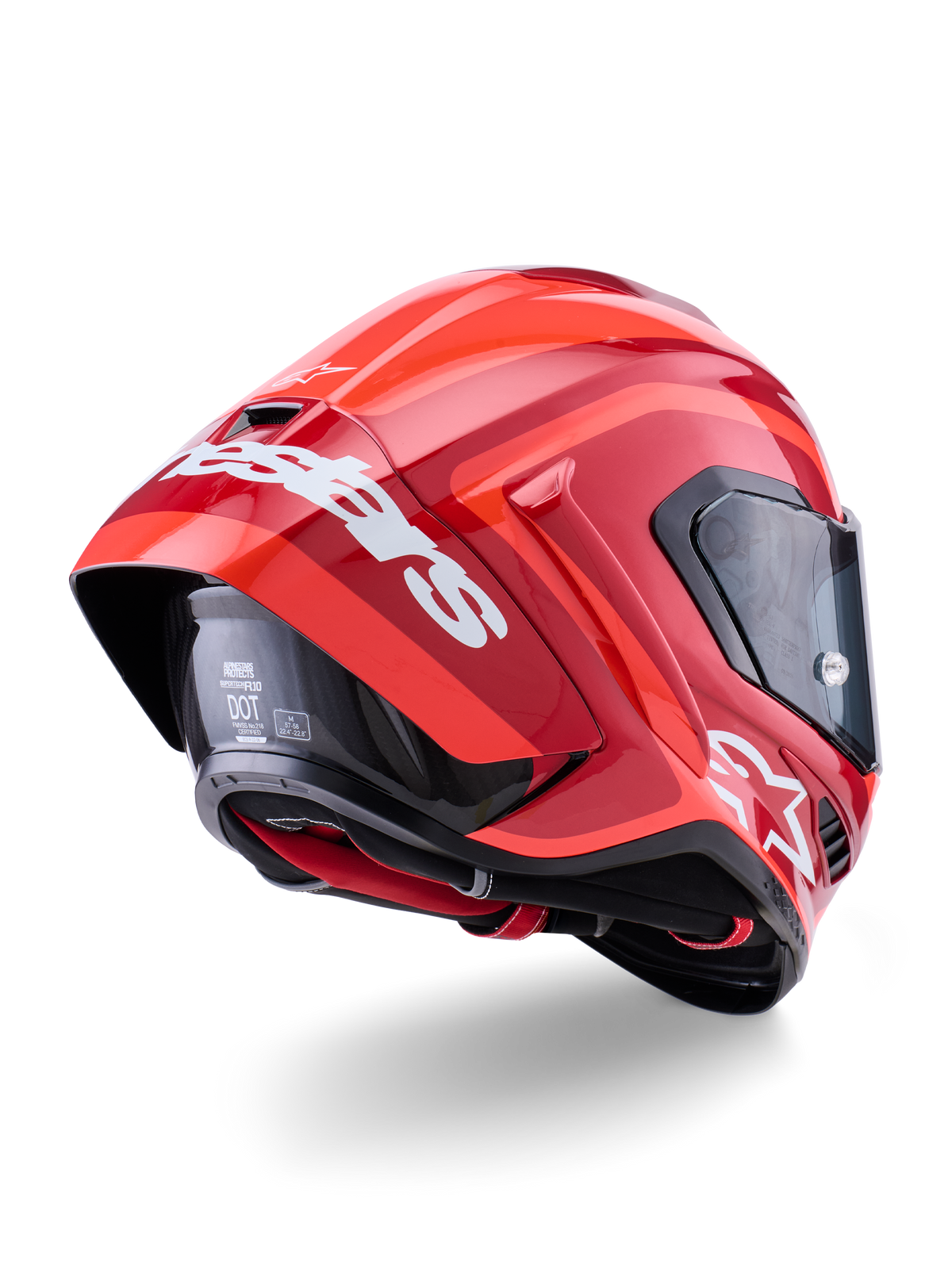 Capacete Alpinestars Supertech R10 Arius, vermelho brilhante com logótipos brancos, vista traseira de três quartos mostrando o spoiler aerodinâmico, construção do casco em fibra de carbono e perfil de corrida elegante com viseira escura