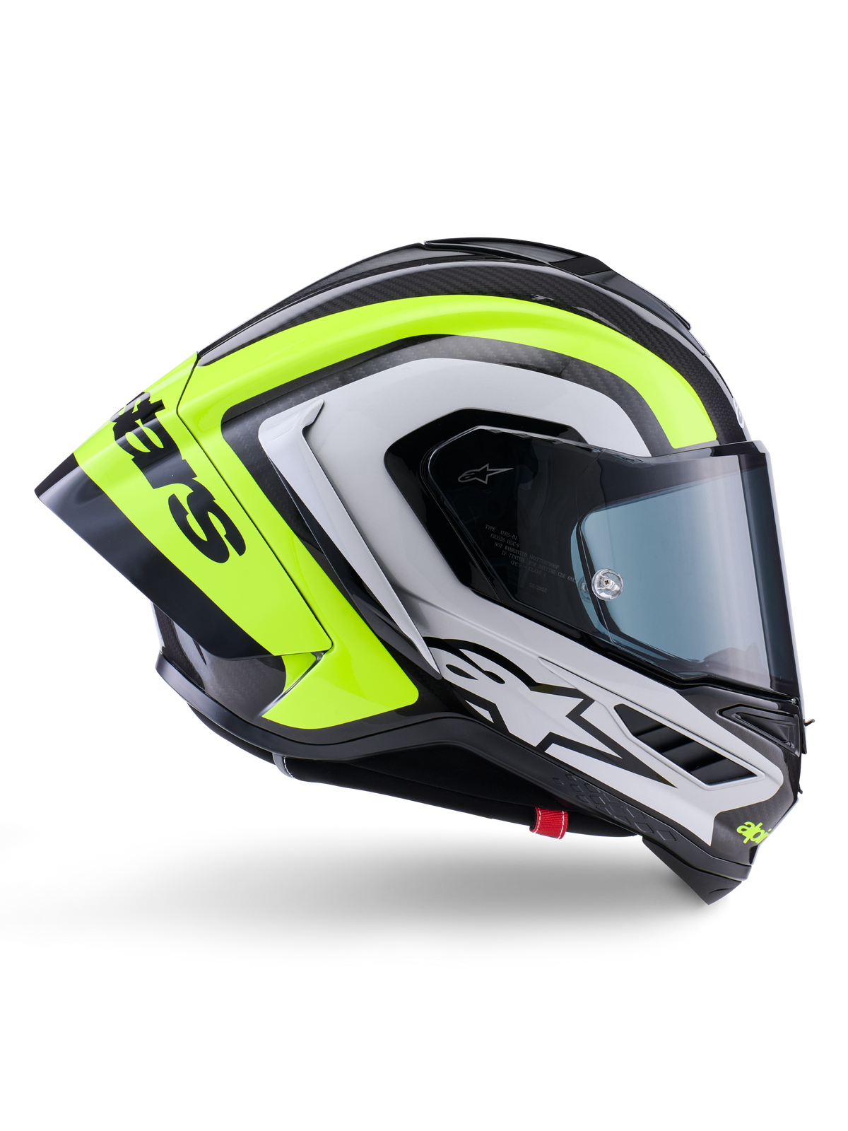 Capacete Alpinestars Supertech R10 Arius, capacete integral de corrida, preto, prateado e amarelo fluorescente brilhante, vista de perfil lateral mostrando o casco aerodinâmico e a viseira fumada escura, construção em fibra de carbono com logótipos em destaque