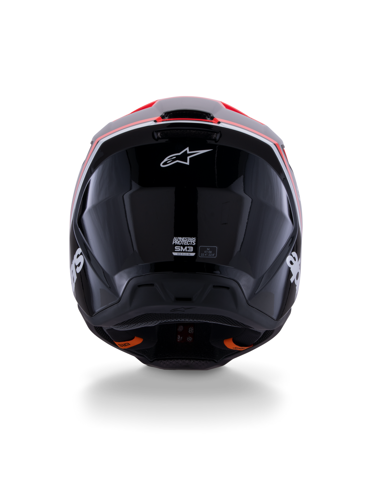 Alpinestars S-M3 Radium Helmet ECE 22.06, capacete de motocross, preto brilhante com detalhes em vermelho fluo e branco, vista traseira exibindo o design aerodinâmico da calota, logótipo da estrela branca e etiquetas de certificação
