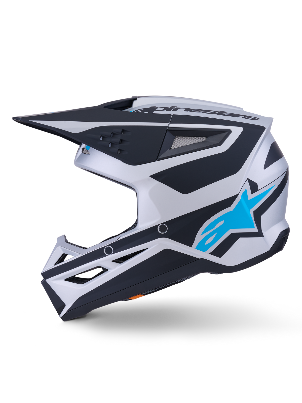 Alpinestars S-M3 Heat Helmet ECE 22.06, capacete de motocross, acabamento mate em prateado, azul e preto, vista de perfil lateral, com logótipo da estrela Alpinestars em azul brilhante, viseira preta e múltiplas aberturas de ventilação, design aerodinâmico agressivo para corridas todo-o-terreno