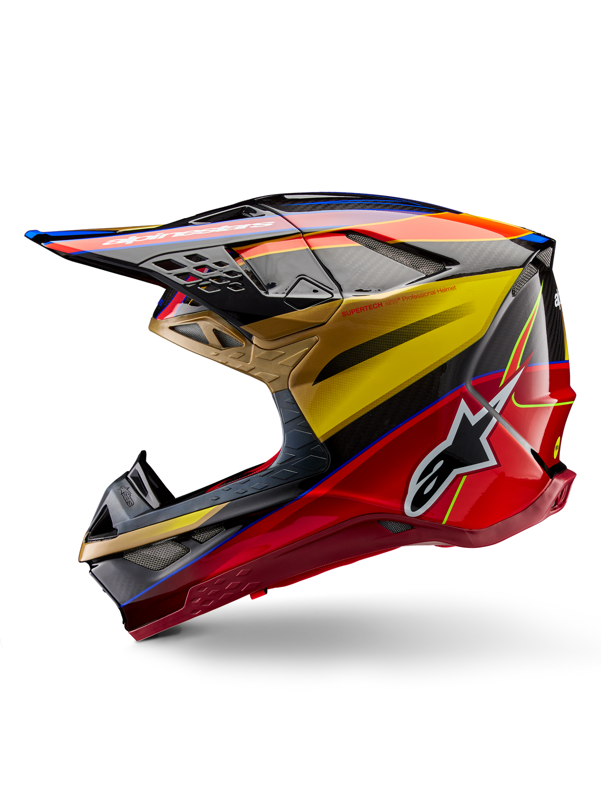 Capacete Alpinestars Supertech M10 Era, capacete de motocross, dourado, amarelo e vermelho Rio brilhante, perfil lateral com textura de fibra de carbono e grafismos arrojados, logótipo de estrela da Alpinestars, formato aerodinâmico com múltiplas aberturas de ventilação, proteção profissional para corridas todo-o-terreno