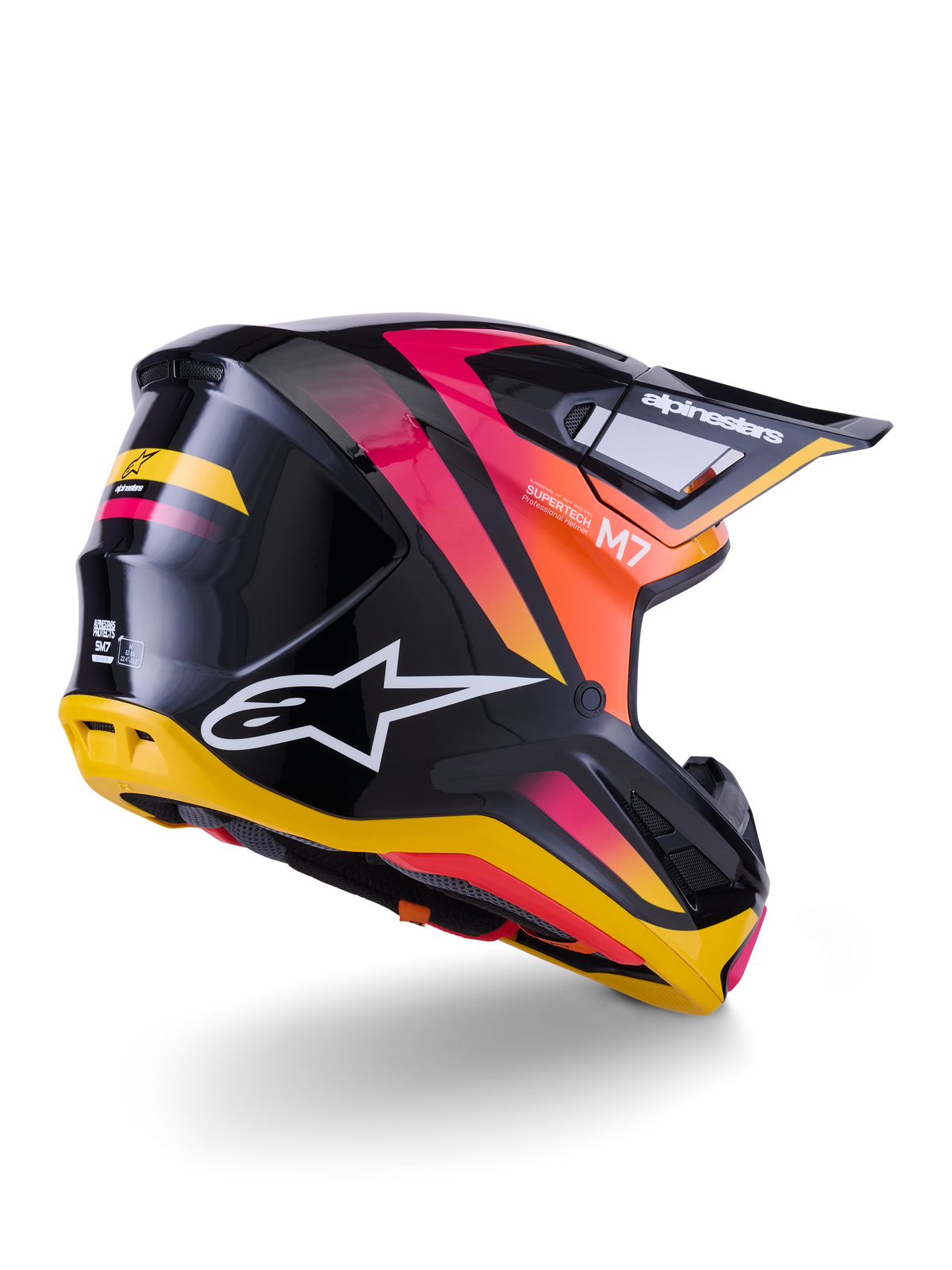 Capacete Alpinestars S-M7 Rise, capacete de motocross, preto, amarelo e rosa brilhante, vista traseira e lateral com calota aerodinâmica em compósito, gradientes vibrantes, logótipo em destaque e aberturas de ventilação