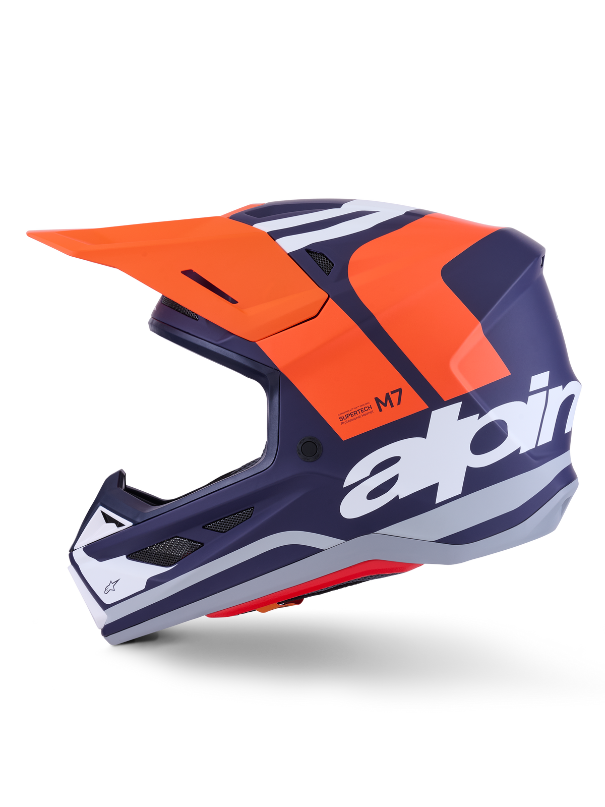 Alpinestars S-M7 Core Helmet ECE 22.06, perfil lateral, acabamento mate em azul-marinho e laranja, logótipo branco de grandes dimensões na lateral, capacete de motocross aerodinâmico com viseira protetora