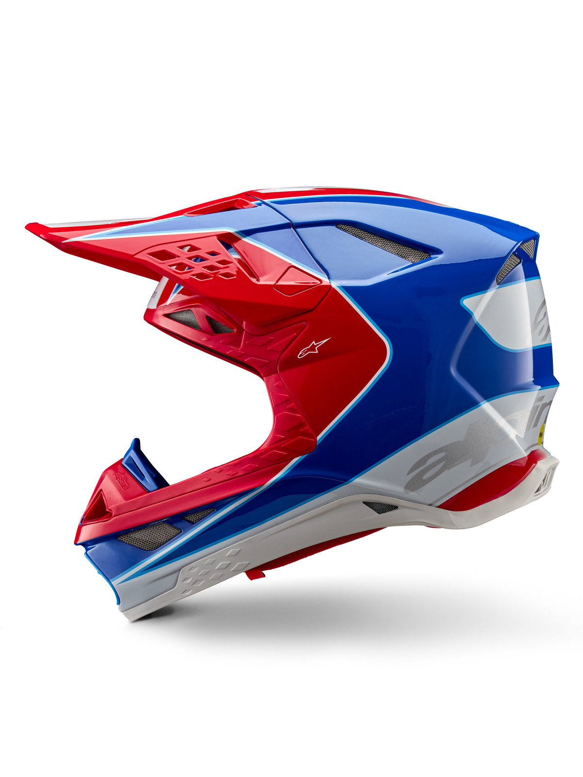Capacete Alpinestars Supertech M10 Aeon ECE 22.06, capacete de motocross, vermelho e azul brilhante, vista de perfil, calota multi-compósita aerodinâmica com aberturas de ventilação integradas e design gráfico em vermelho e azul, acabamento brilhante para competições off-road