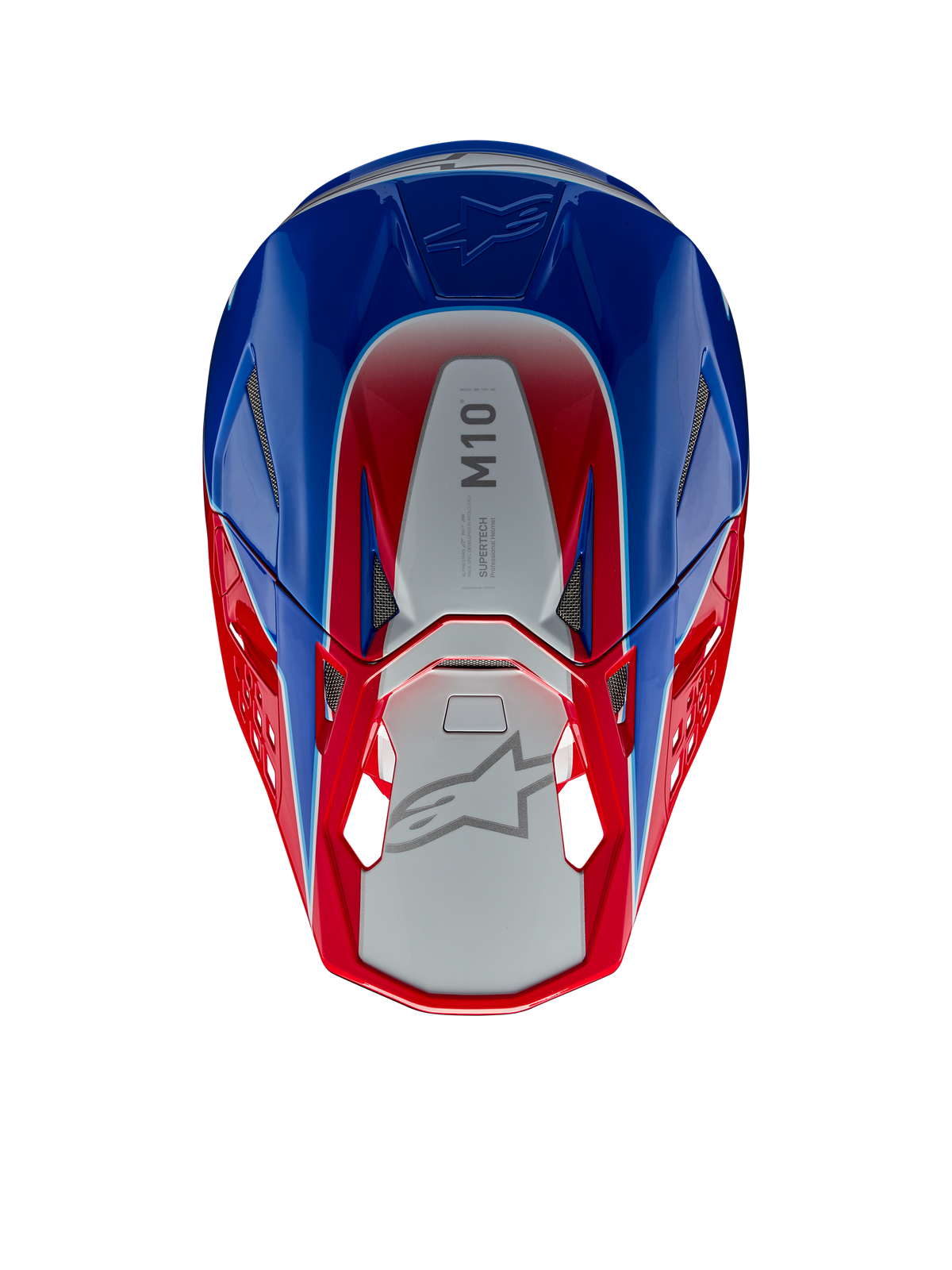 Capacete Alpinestars Supertech M10 Aeon, capacete de motocross, vermelho e azul brilhante, vista superior mostrando o painel central prateado com a marca M10, calota aerodinâmica com detalhes em vermelho e azul, aberturas de ventilação em malha, proteção de cabeça de alta performance para motocross