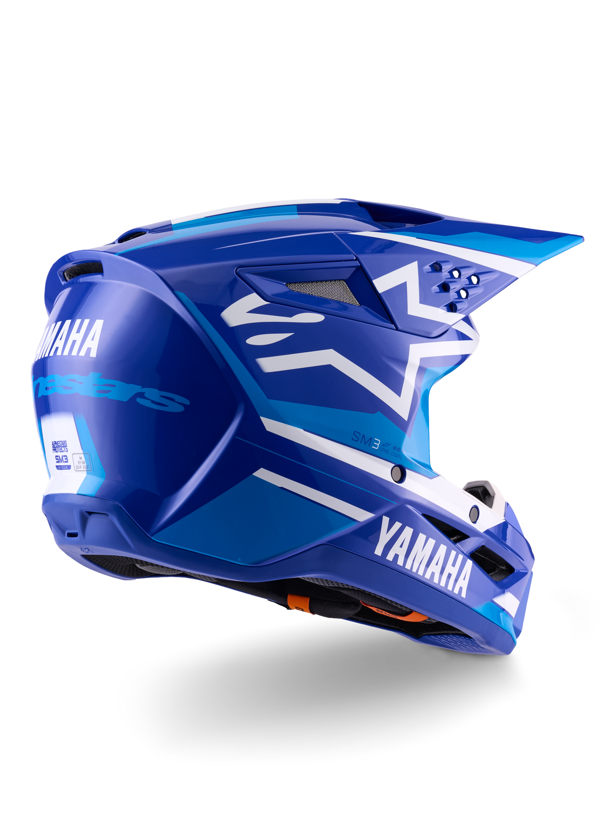 Alpinestars Yamaha S-M3 Helmet ECE 22.06, capacete de motocross, azul e branco brilhante, com logótipos Yamaha e Alpinestars, logótipo de estrela branca na lateral, múltiplas aberturas de ventilação de entrada e exaustão, design aerodinâmico para performance em todo-o-terreno