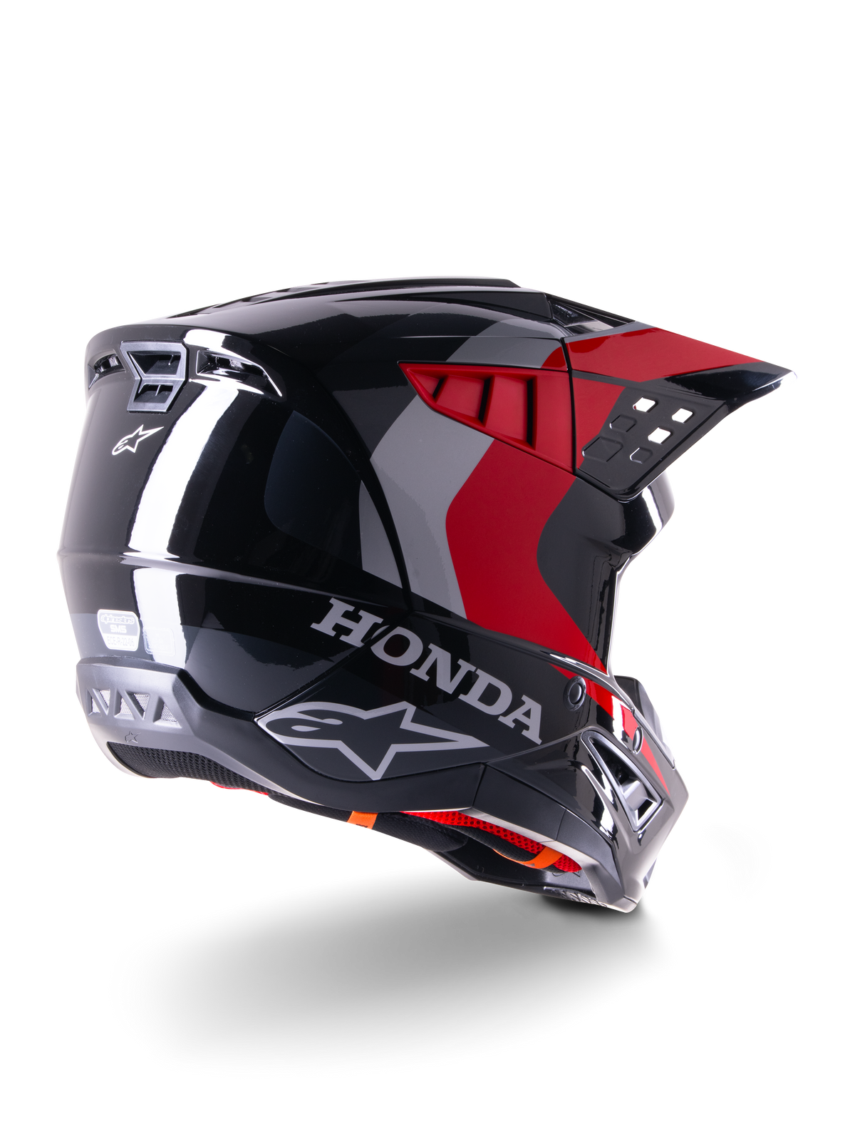 Alpinestars Honda S-M5 Helmet ECE, capacete de motocross, preto e vermelho brilhante, vista traseira de três quartos com marca Honda e logótipos Alpinestars, acabamento brilhante com detalhes gráficos vermelhos e cinzentos, concebido para proteção em todo-o-terreno