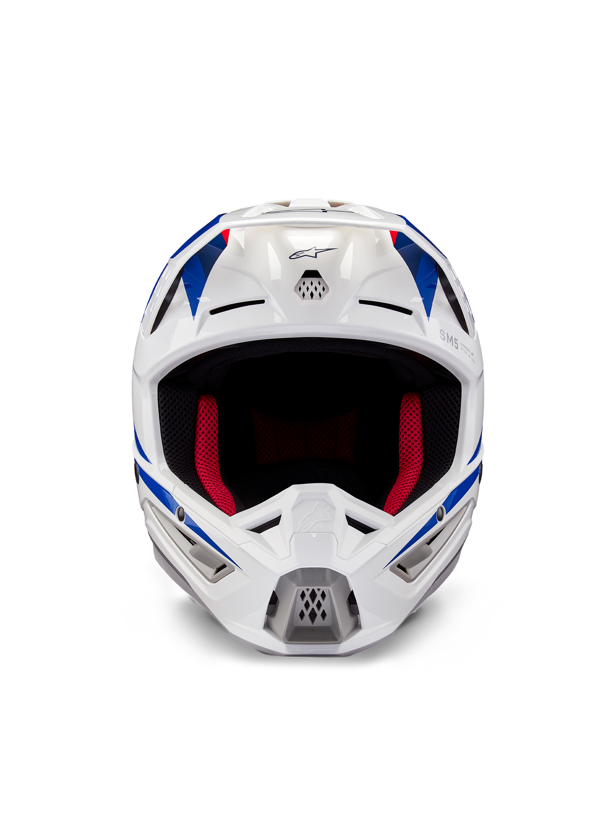 Capacete Alpinestars Honda S-M5 ECE, capacete de motocross, branco, azul e vermelho brilhante, vista frontal mostrando as aberturas de ventilação e o forro interno vermelho, design aerodinâmico para proteção em competições de todo-o-terreno