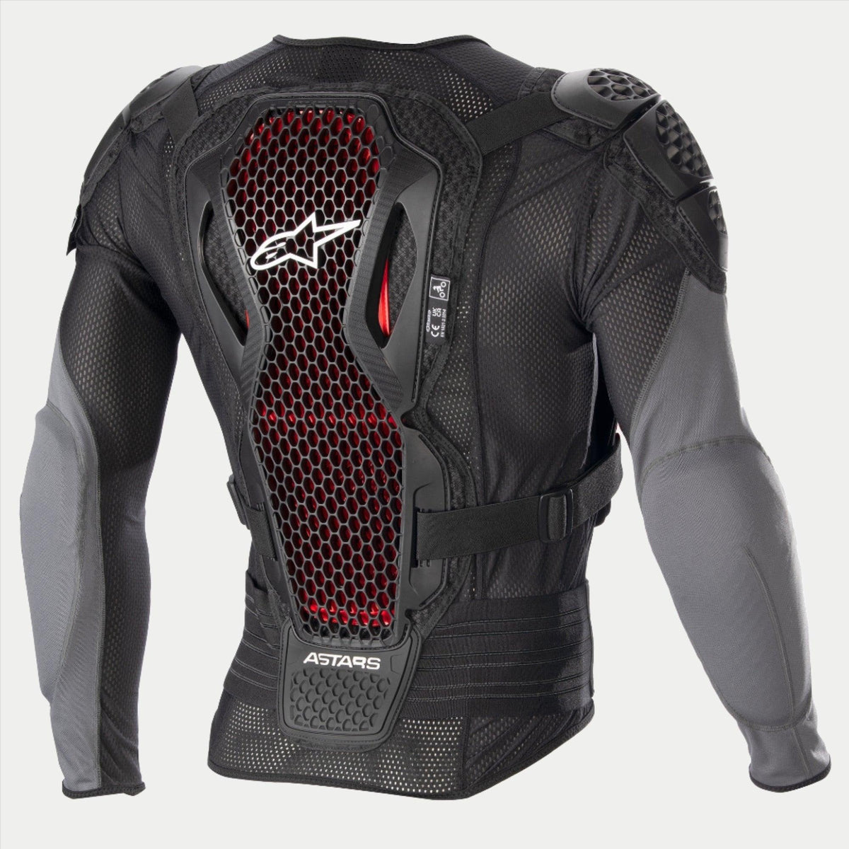 Casaco de Proteção Alpinestars Bionic Plus V2, casaco de proteção para motocross, preto e cinzento antracite com detalhes em favo de mel vermelhos, vista traseira mostrando o protetor de costas com tecnologia Nucleon Cell de Nível 2, tecido de malha perfurada e proteções integradas nos ombros e cotovelos.