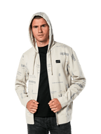 Alpinestars Plenitude Hoodie, casual sportswear, Off White zip-front fleece with all-over grey logo graphics, worn by a man with the hood up over a black shirt, featuring a small chest logo patch and kangaroo pocket