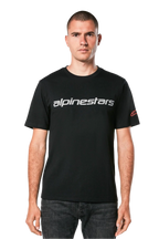 Alpinestars Linear Wordmark 2.0 CSF Tee, Short Sleeve T-Shirt, Black, Grey linear wordmark across the chest and red Ageless logo on the sleeve, worn by a model with dark jeans, casual motorsport-inspired streetwear