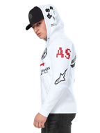 Alpinestars Variegate Hoodie, hoodie de lã branco com fecho de correr frontal, arte com múltiplos logótipos nas mangas e capuz com letras 'AS' vermelhas e logótipo de estrela preto, vestido por um homem com boné preto, streetwear casual de motorsport