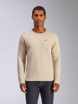 Alpinestars Positive Crew, camisola de gola redonda, Off White, com um pequeno logótipo de estrela preto no peito, detalhe de costura em V na gola, punhos e bainha canelados, streetwear casual inspirado no desporto motorizado