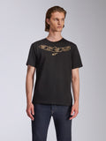 Alpinestars Luxo CSF Tee, Short Sleeve T-Shirt, Black, Gold Outlined Astars Logo on Chest, worn with dark blue jeans, Casual Motorsport Streetwear
