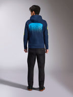 Alpinestars Obsessed Hoodie in Navy Blue, back view featuring a large cyan MX gradation graphic and yellow sleeve logos, casual motorsport-inspired pullover fleece.