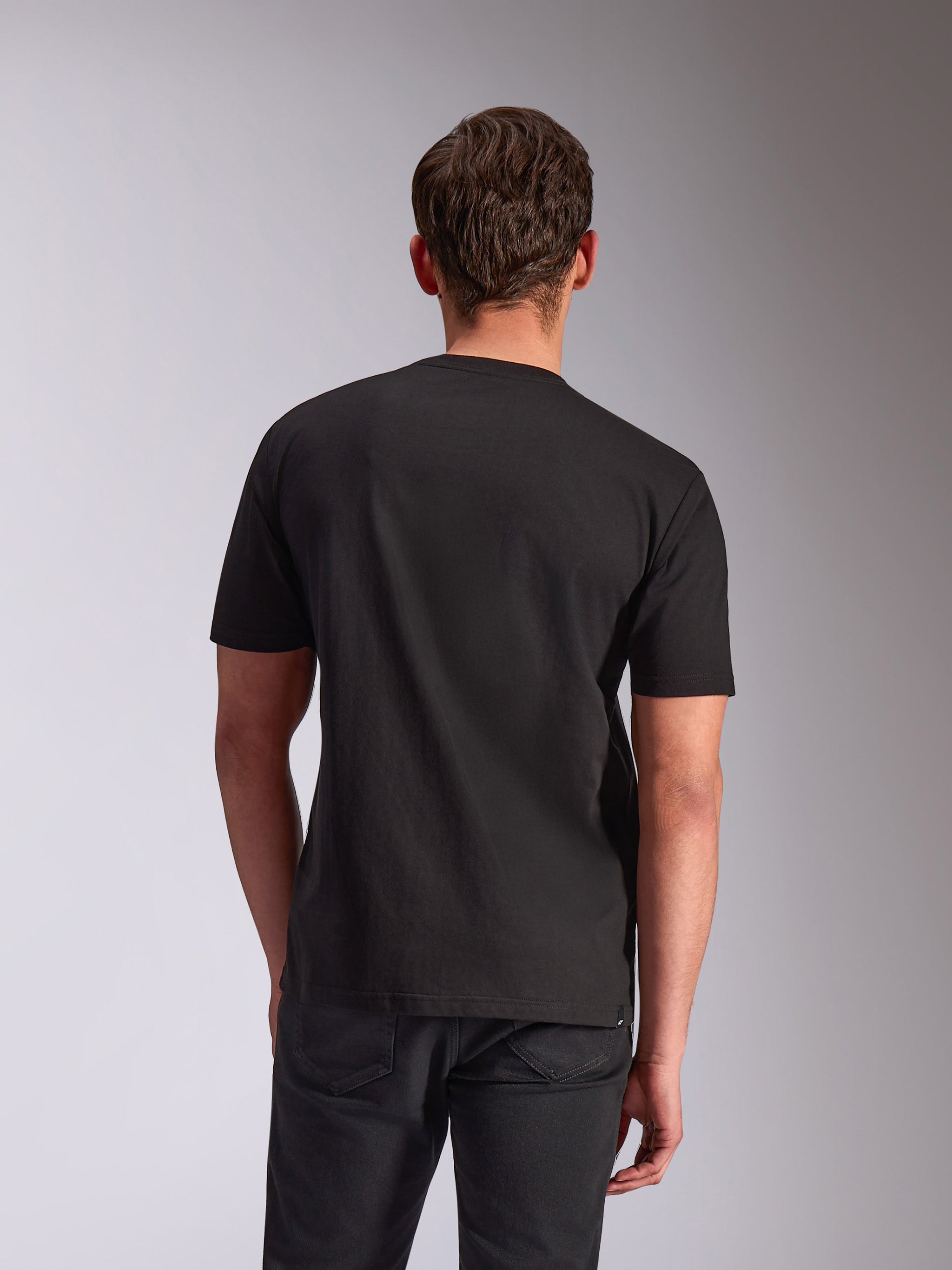 Alpinestars Trifecta CSF Tee, Short Sleeve T-Shirt, Black, back view on model, casual motorsport-inspired streetwear
