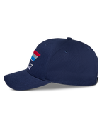 Boné Alpinestars Trifecta Snapback, azul-marinho, vista lateral, com pala curva e grafismo de riscas tricolores com texto branco, boné casual de estilo motorsport
