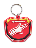 Alpinestars Plate Keyfob, porta-chaves moldado em 3D, vermelho, amarelo e preto, logótipo Alpinestars e símbolo de estrela Astars em branco, argola metálica prateada, design de placa MX inspirado no motociclismo