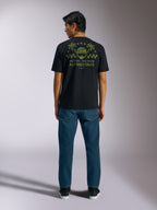 Alpinestars Order CSF Tee, Short Sleeve T-Shirt, Black, Back view featuring olive green helmet and palm tree graphic with 'One Goal One Vision' text, Casual Motorsport Streetwear